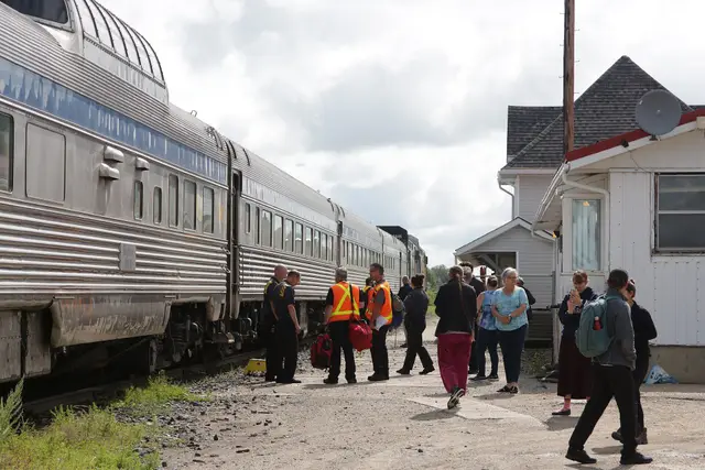 Passengers beside the VIA Rail train at Canora station